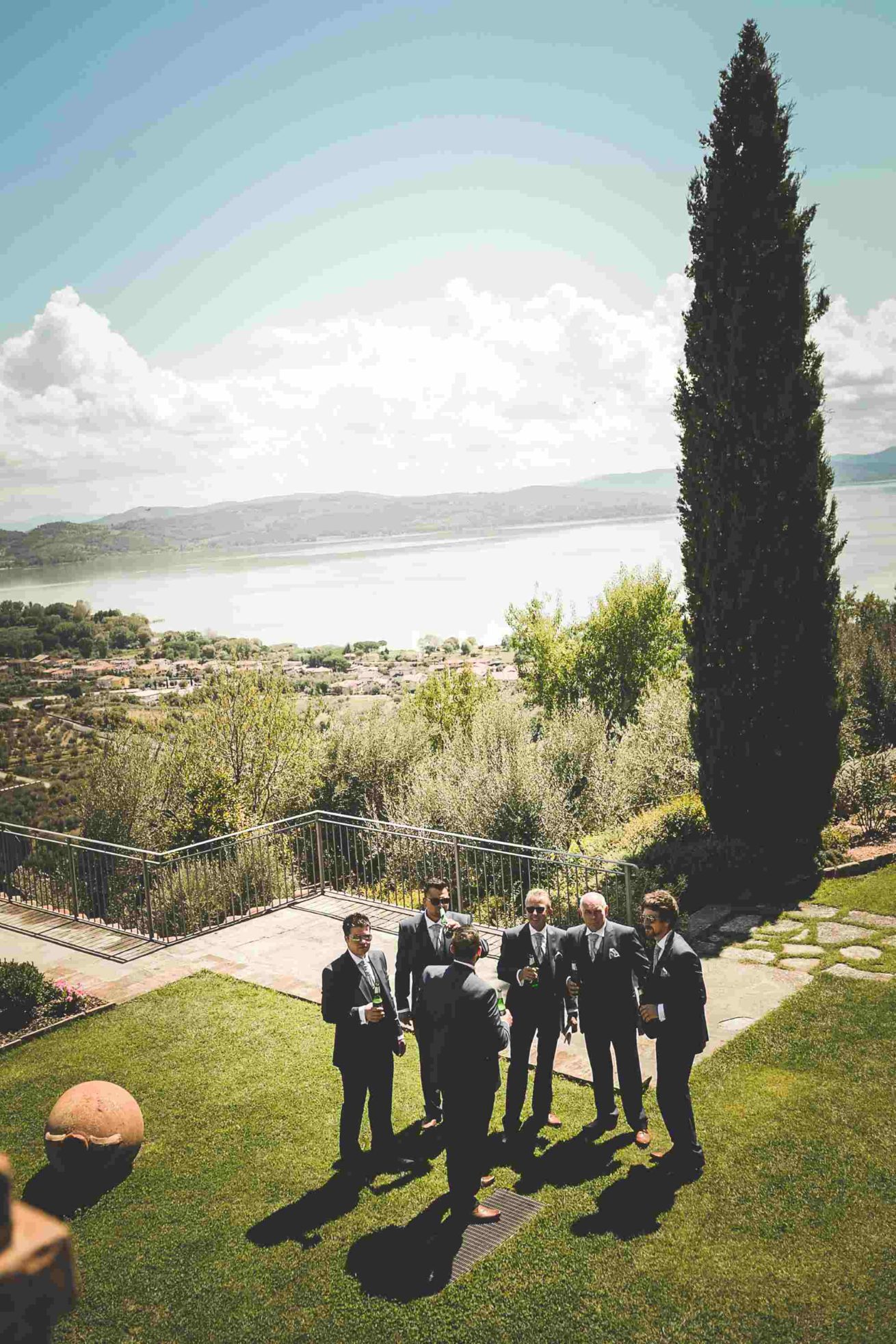 Garden villa wedding Italy. Lads relaxing drink before the ceremony...