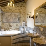 italy wedding venues. The Wedding Suite bathroom, detail of the Roman mosaic and the Carrara marble sink