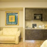 italian wedding villas. Detail of the single Sofa bed and kitchen area with microwave.