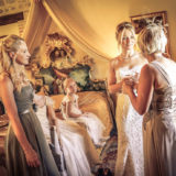 Bride and mother chat in the italy wedding villas suite of Villa San Crispolto
