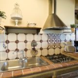Kitchen area with double sink, cooking area, toaster and kettle. wedding tuscany villa