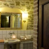 Details of the bathroom with the marble sink and antique mirror. wedding villa tuscany