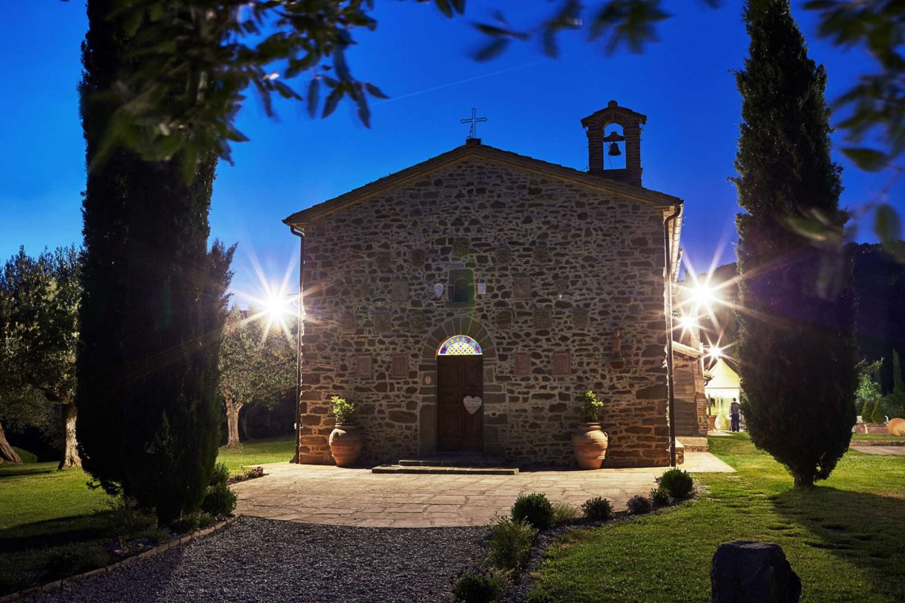 The facade of Exclusive weddings villa Italy San Crispolto chapel at night